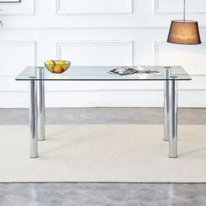 A modern minimalist style glass dining table with glass table top and silver metal legs